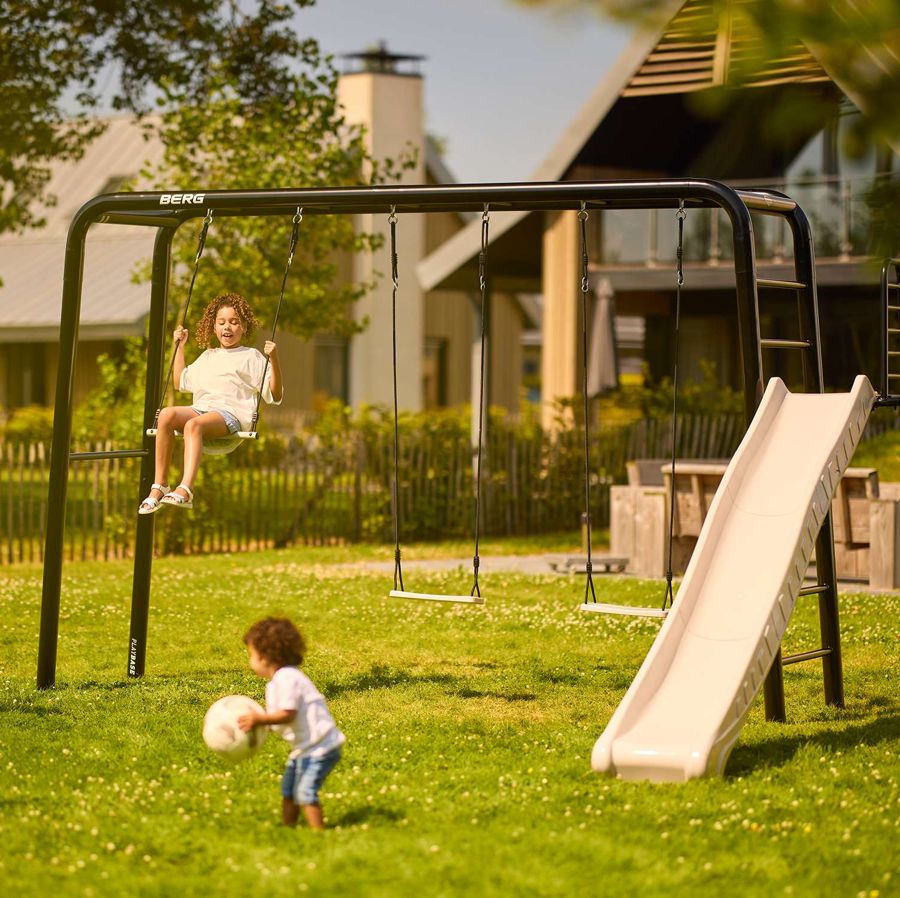 Children on the swings of a BERG PlayBase frame
